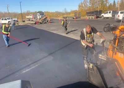 parking lot paving edmonton - workers paving